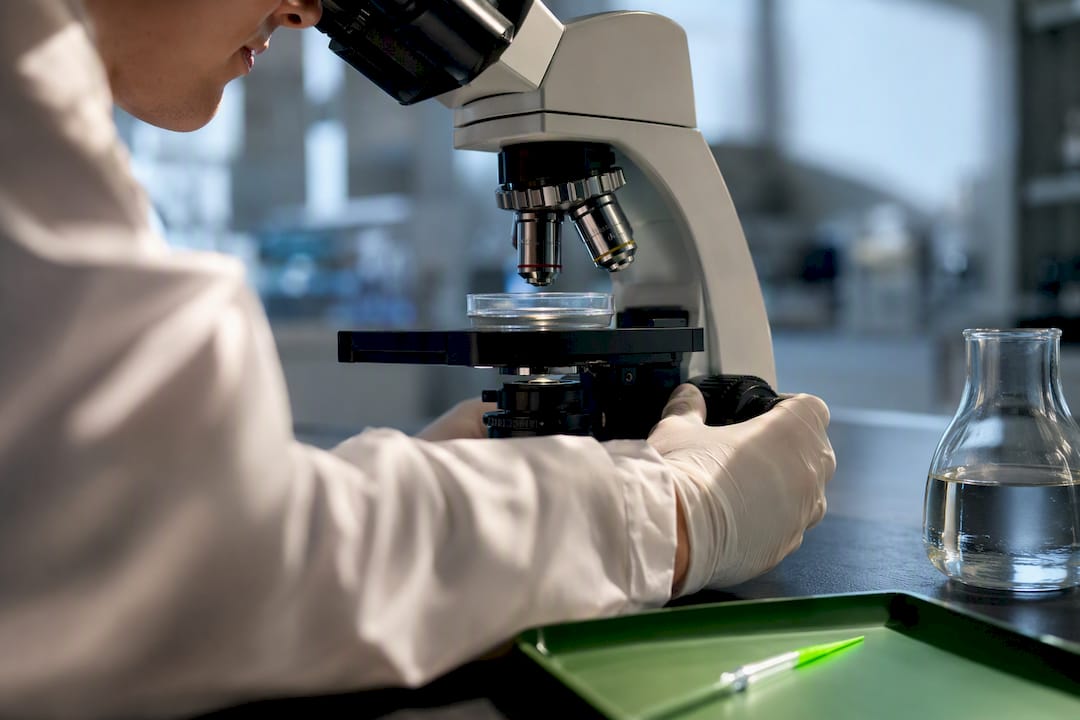 Researcher examining hyaluronic acid sample