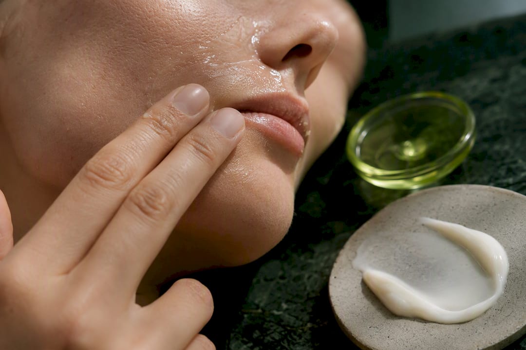 Layering serum and cream on facial skin