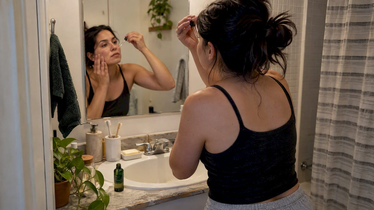 Woman applying Copper Peptide Anti-Aging Serum