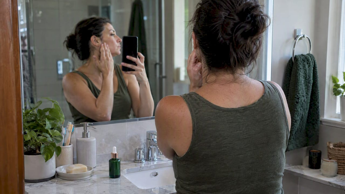 Woman taking a baseline skincare progress photo